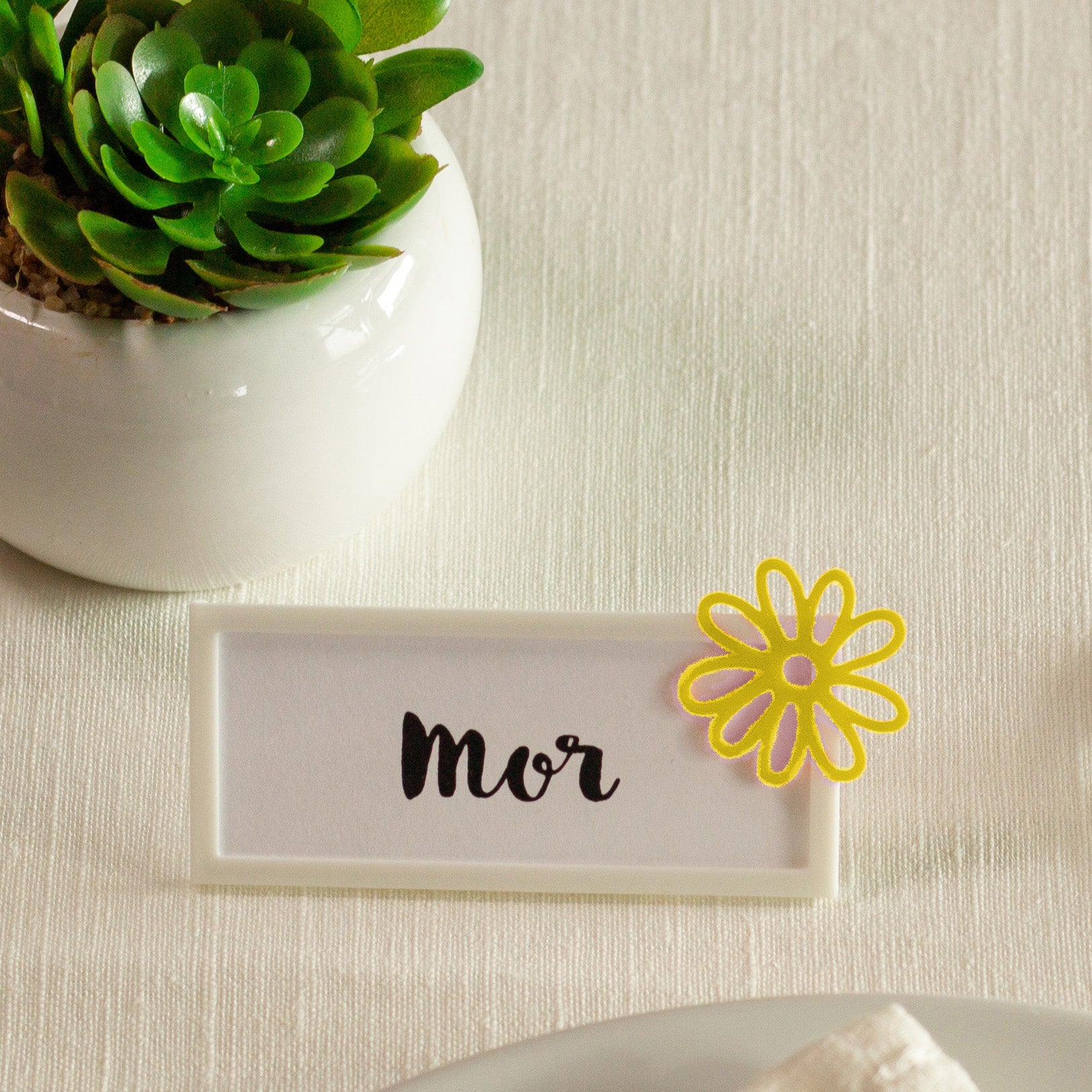 Bordkort med blomst gul