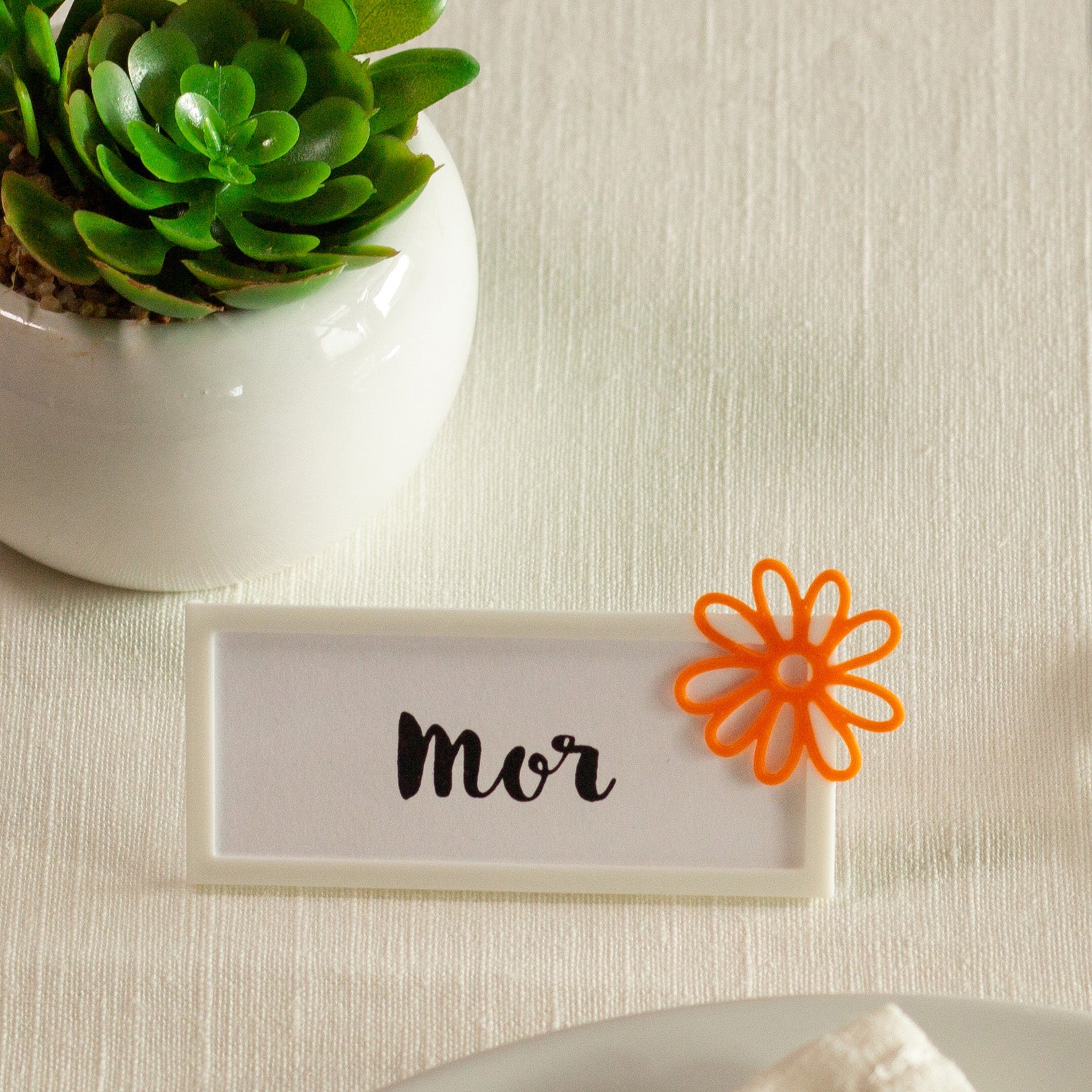 Bordkort med blomst orange